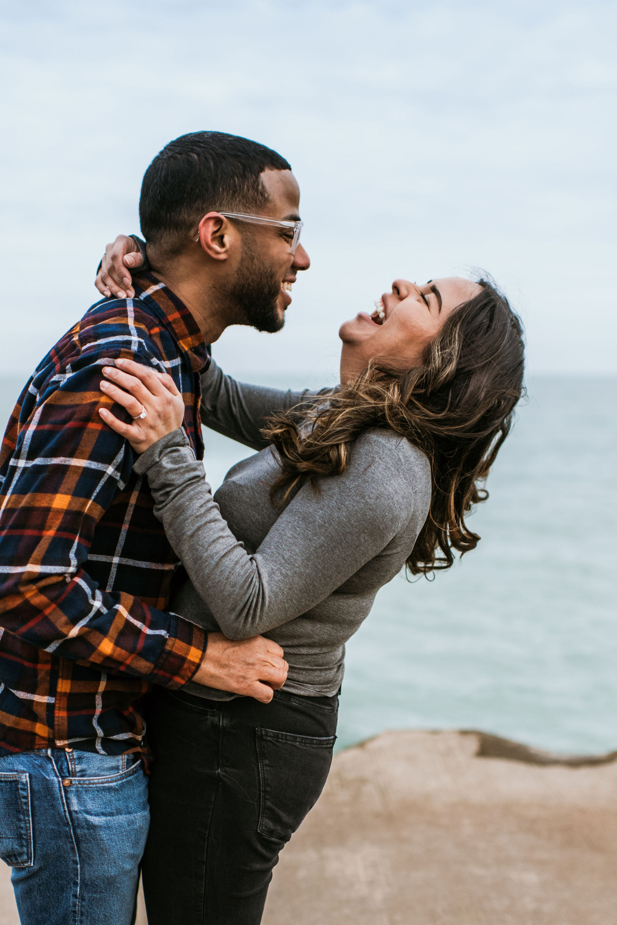 Fullerton Beach, Chicago Illinois Engagement session, Photographs by Teresa. This blog post includes outfit ideas for an outdoor couples session and posing inspiration. Book your Chicago Illinois couples session and browse the blog for inspiration #engagement #photography #engagementphotography #chicagophotographer