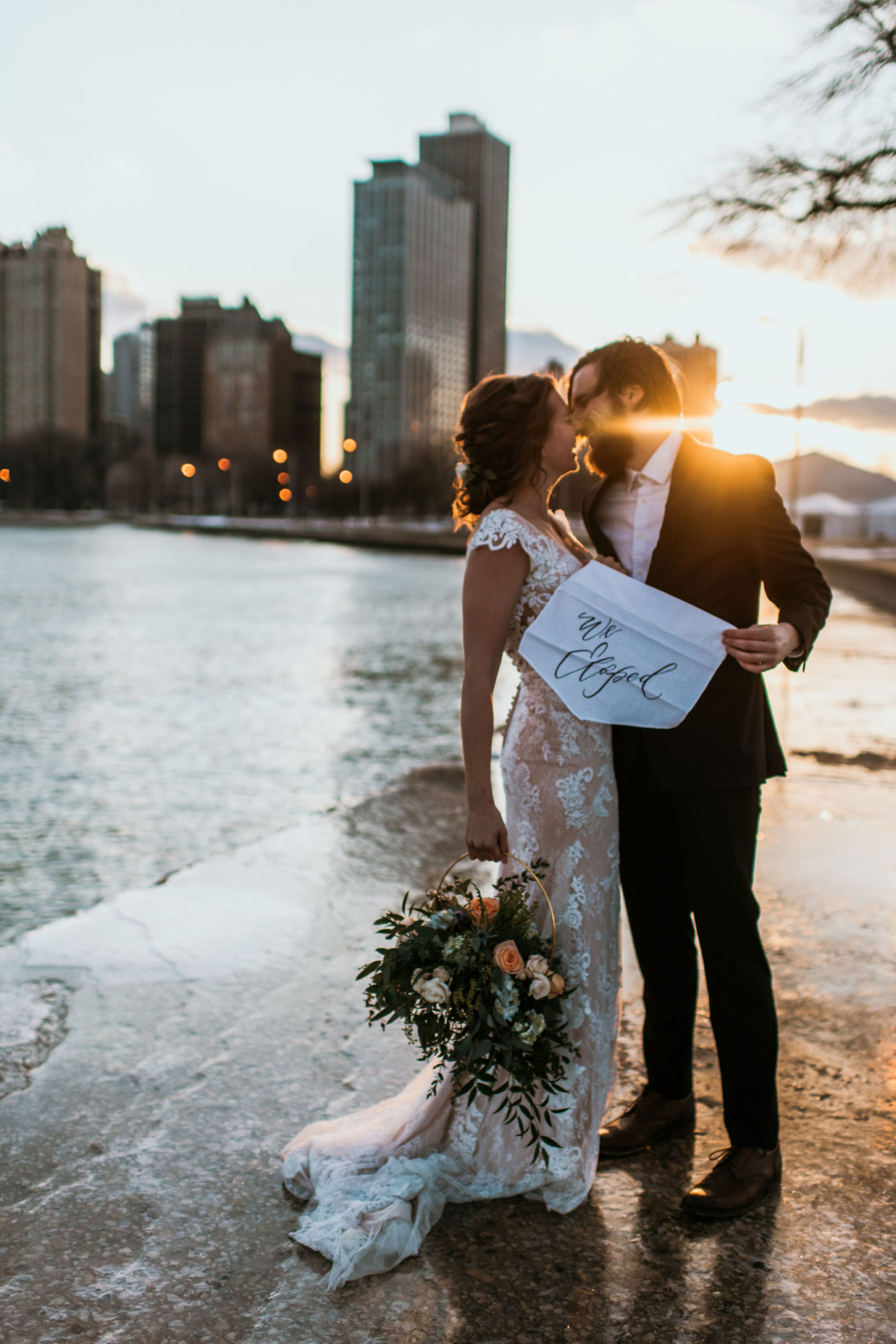 chicago elopement including bride and groom portrait, Chicago skyline and flowers inspiration by Photographs by Teresa